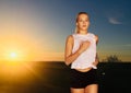 Happy young woman running outdoors Royalty Free Stock Photo