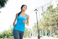 Happy young woman running outdoors Royalty Free Stock Photo