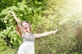 Happy Young Woman Enjoying Summer on the Green Meadow. Royalty Free Stock Photo