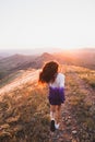 Happy young woman running in sunset light. Freedom concept Royalty Free Stock Photo