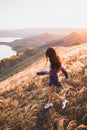 Happy young woman running in sunset light. Freedom concept Royalty Free Stock Photo