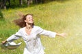 Happy Young Woman Enjoying Summer on the Green Meadow. Royalty Free Stock Photo