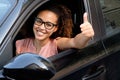 Happy young woman seated in her new car Royalty Free Stock Photo
