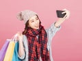 Happy young woman with shopping bags. Winter sale Royalty Free Stock Photo