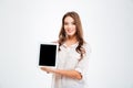 Happy young woman showing blank tablet computer screen Royalty Free Stock Photo