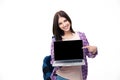 Happy young woman showing finger on laptop screen