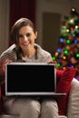 Happy young woman showing laptop blank screen Royalty Free Stock Photo