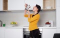 Happy Young woman showing moka pot