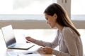 Smiling young woman read pleasant news in letter Royalty Free Stock Photo