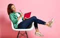 Young woman studying whith notepad in a chair Royalty Free Stock Photo