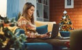 Happy woman doing online shopping at Christmas