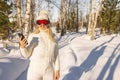 Happy young woman using smartphone makes selfie for her profile Royalty Free Stock Photo