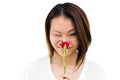 Happy young woman smelling rose Royalty Free Stock Photo
