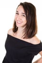 Happy young woman smiling in black fashion shirt over white background