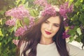 Happy young woman with spring flowers outdoors Royalty Free Stock Photo