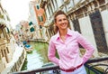 Young woman standing on bridge in venice, italy Royalty Free Stock Photo