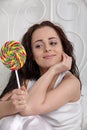 Happy young woman with sugar candy Royalty Free Stock Photo