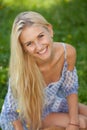 Happy young woman on a summer flower meadow outdoor Royalty Free Stock Photo