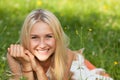 Happy young woman on a summer flower meadow outdoor Royalty Free Stock Photo