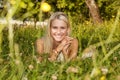 Happy young woman on a summer flower meadow outdoor Royalty Free Stock Photo