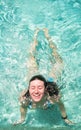 Happy Young Woman Swimming