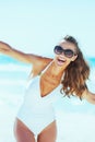 Happy young woman in swimsuit having fun time on beach Royalty Free Stock Photo