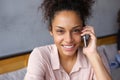 Happy young woman talking on cell phone Royalty Free Stock Photo
