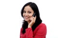 Happy young woman talking on mobile phone Royalty Free Stock Photo