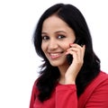 Happy young woman talking on mobile phone Royalty Free Stock Photo