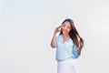 Happy young woman talking on the phone and happy, smiling white teeth against a mountain landscape Royalty Free Stock Photo