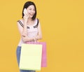 Happy young woman talking on the phone and  holding shopping bags Royalty Free Stock Photo