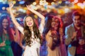 Happy young woman or teen dancing at disco club Royalty Free Stock Photo