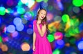 Happy young woman or teen girl in party cap Royalty Free Stock Photo