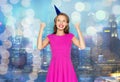 Happy young woman or teen girl in party cap Royalty Free Stock Photo