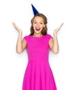 Happy young woman or teen girl in party cap Royalty Free Stock Photo