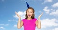 Happy young woman or teen girl in party cap Royalty Free Stock Photo