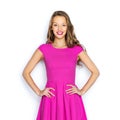 Happy young woman or teen girl in pink dress Royalty Free Stock Photo