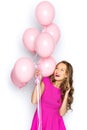 Happy young woman or teen girl in pink dress Royalty Free Stock Photo