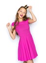 Happy young woman or teen girl in pink dress Royalty Free Stock Photo