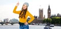 Happy young woman or teen girl pointing finger up Royalty Free Stock Photo