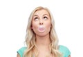 Happy young woman or teenage girl chewing gum Royalty Free Stock Photo