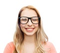 Happy young woman or teenage girl in eyeglasses Royalty Free Stock Photo