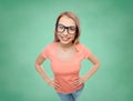 Happy young woman or teenage girl in eyeglasses Royalty Free Stock Photo