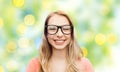 Happy young woman or teenage girl in eyeglasses Royalty Free Stock Photo