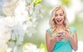 Happy young woman or teenage girl with smartphone Royalty Free Stock Photo