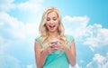 Happy young woman or teenage girl with smartphone Royalty Free Stock Photo