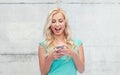 Happy young woman or teenage girl with smartphone Royalty Free Stock Photo