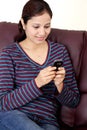 Happy Young woman text messaging Royalty Free Stock Photo