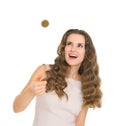 Happy young woman tossing coin Royalty Free Stock Photo