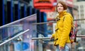 Happy young woman tourist sightseeing at Times Square in New York City. Female traveler enjoying view of downtown Manhattan. Royalty Free Stock Photo